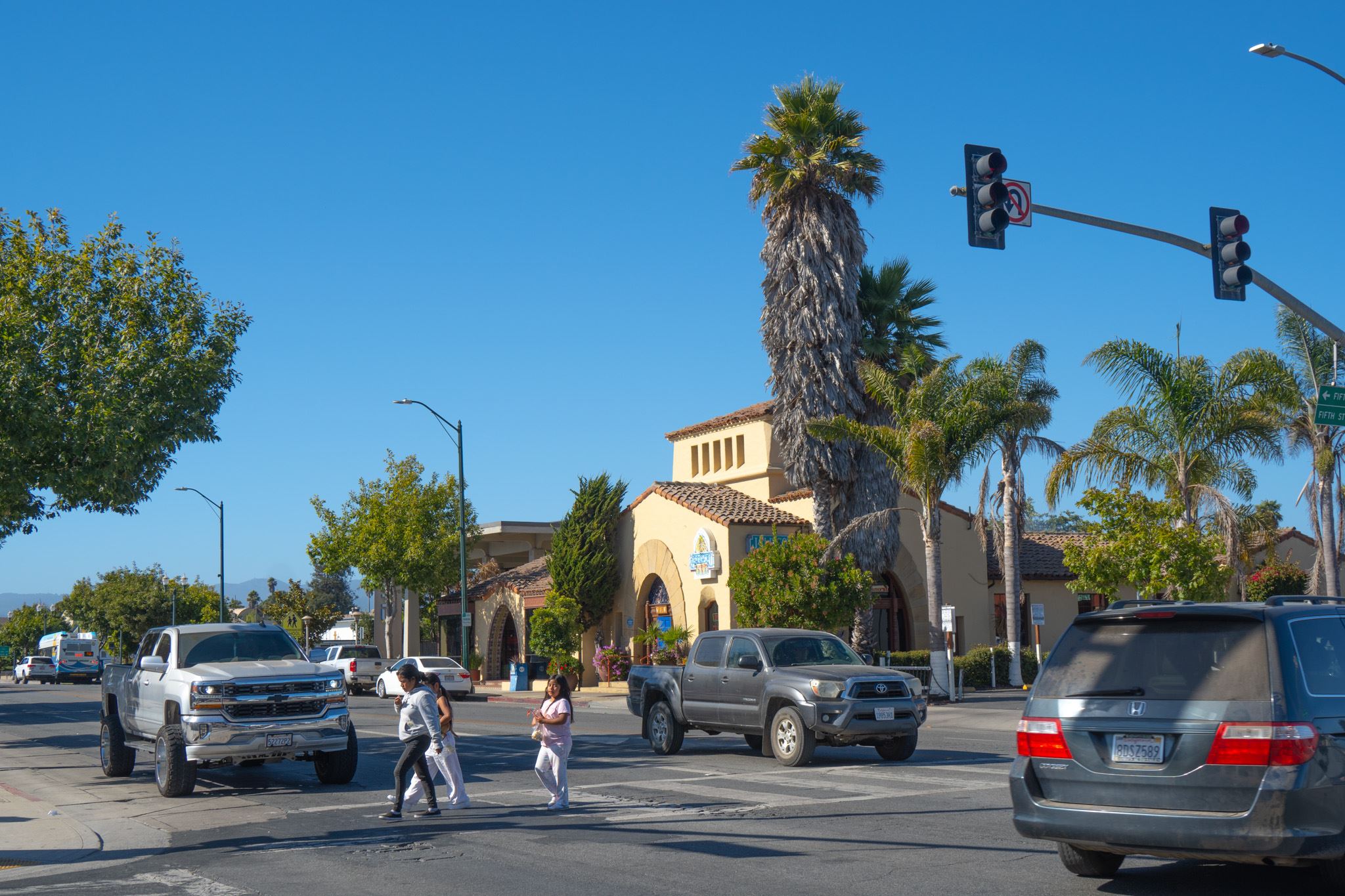 People crossing at intersection on Main Street