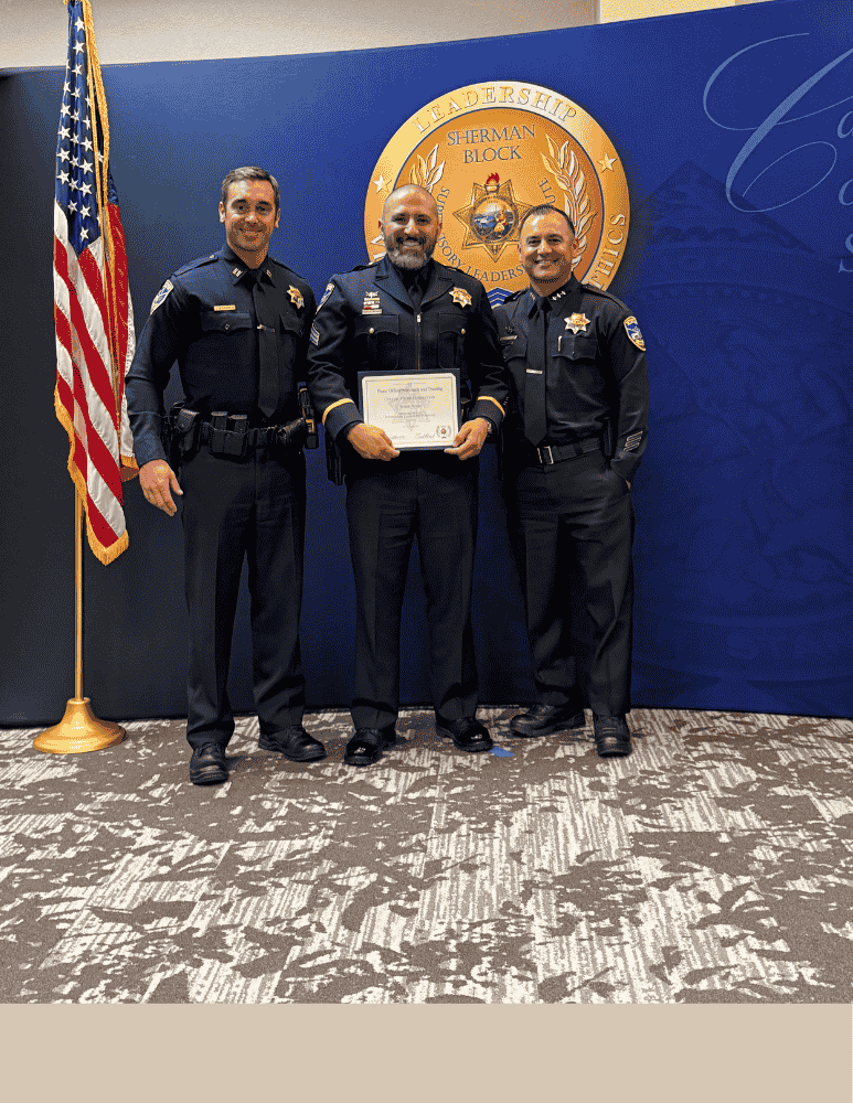 Sgt. Ayala at his SLI graduation. Posing on the photo are Cpt. Fulgoni, Sgt. Ayala and AC Rodriguez