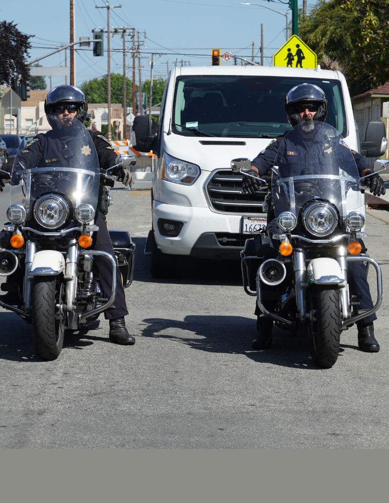Officers in motorcycles doing an escort for WHS athletes