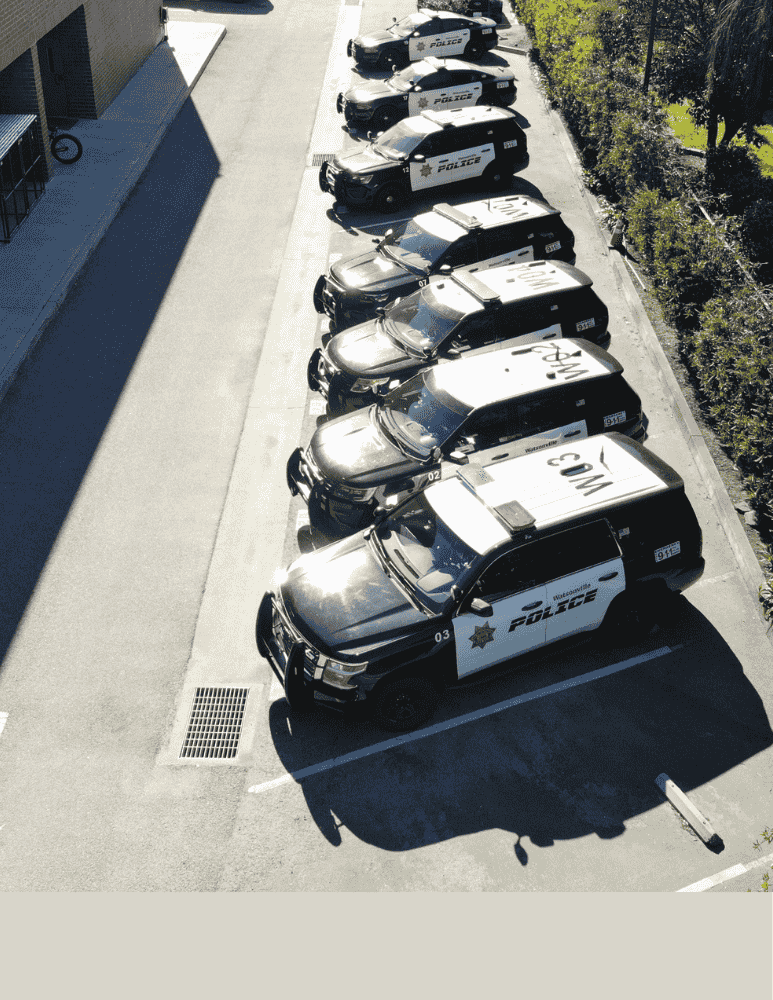 Aerial photo of police patrols cars parked at the police department 