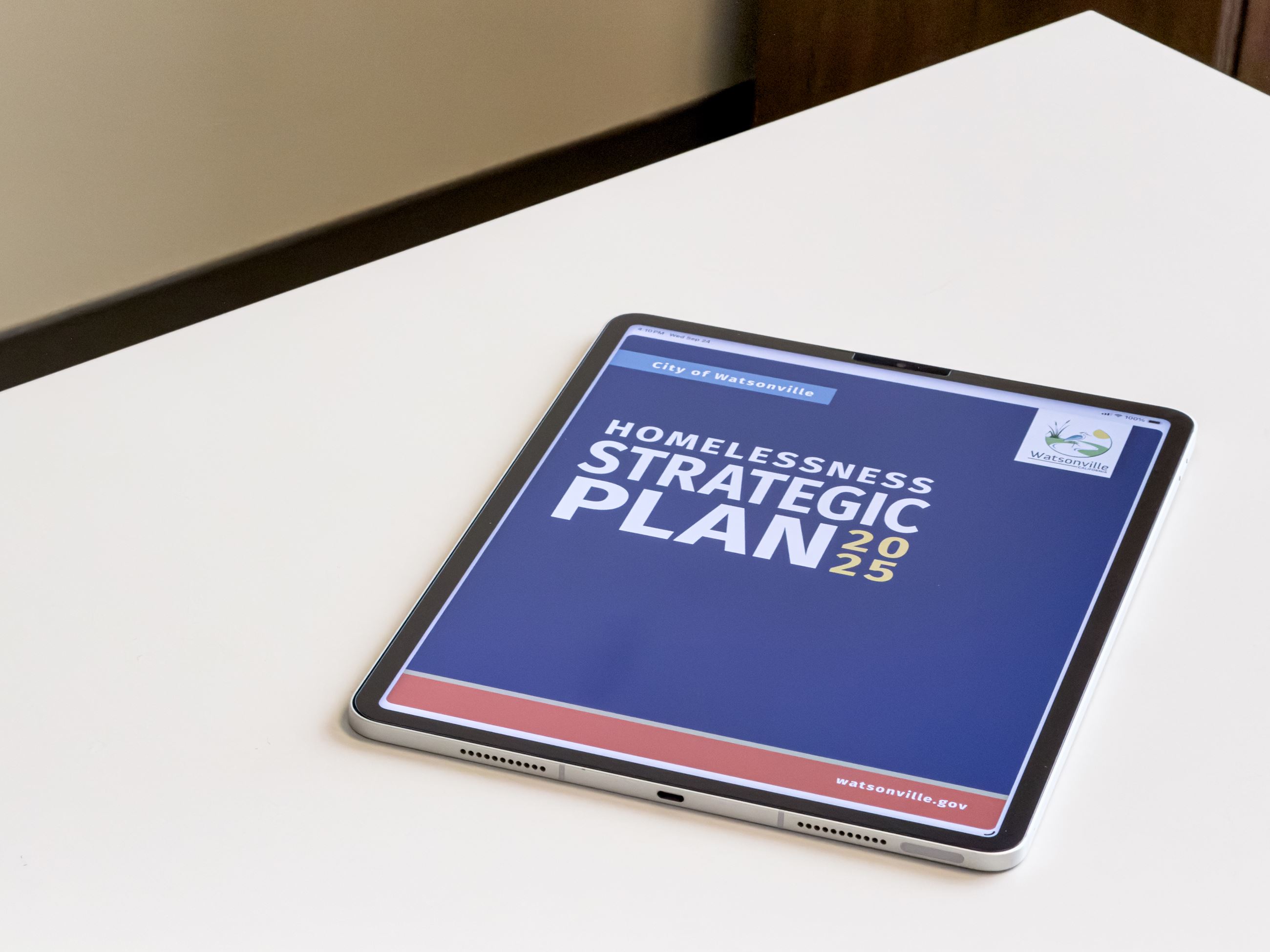 Homelessness Strategic Plan Cover Page on an Ipad 