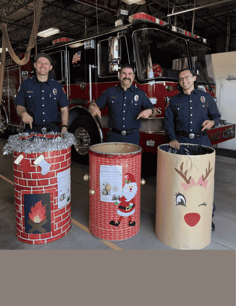 Three firefighters smiling with collection barrels 