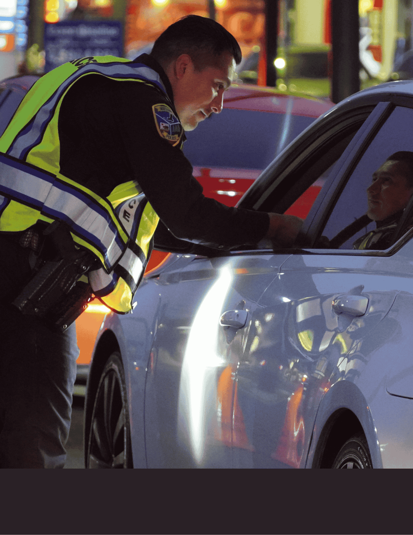 Officer checking a Driver's License during a DUI Checkpoint