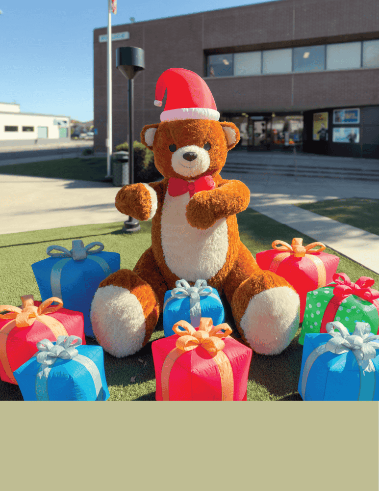 Giant inflatable teddy bear with presents in front of the police lobby 