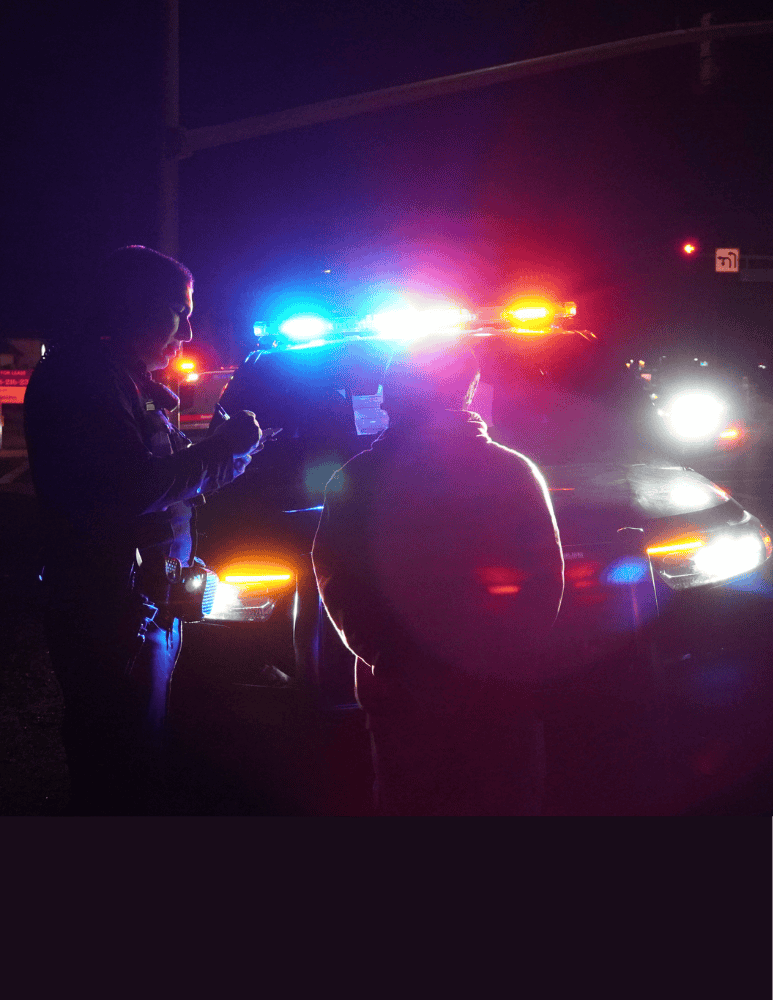 Officers conducting a Field Sobriety Test on a driver 