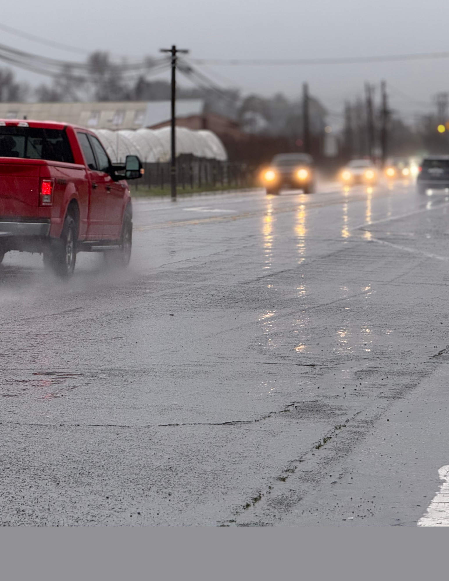 Cars driving under the rain