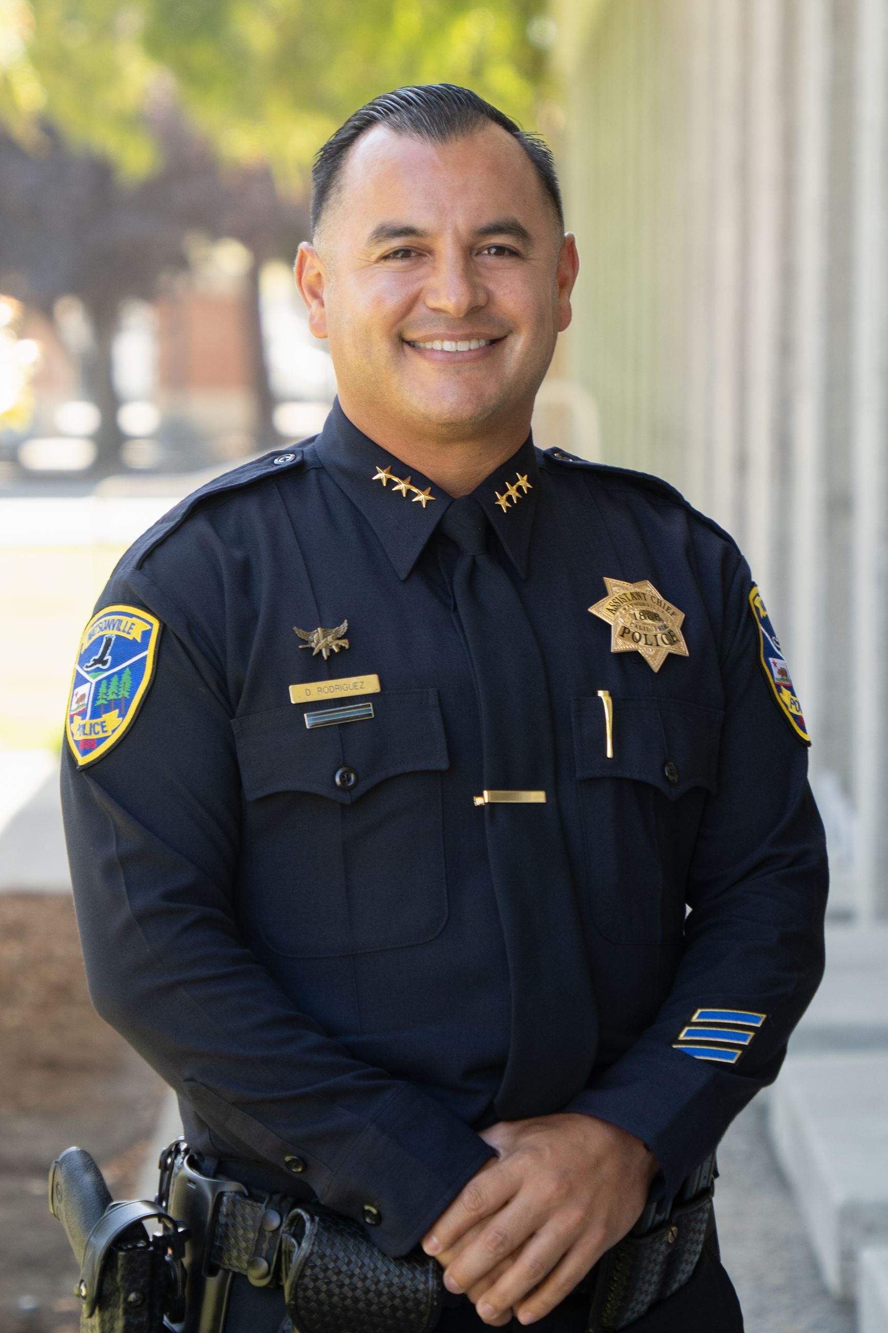 Assistant Chief D. Rodriguez posing for photo 